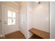Neat mudroom with a wooden bench, hooks, and a bright entrance at 10483 St Anne Dr, Zionsville, IN 46077