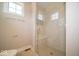 Modern shower with glass door, bench, and subway tile at 10483 St Anne Dr, Zionsville, IN 46077