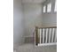Bright staircase with neutral carpet and white railing, showcasing a modern design with plenty of natural light at 10483 St Anne Dr, Zionsville, IN 46077