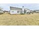 Spacious backyard featuring a patio, trampoline, and white home exterior at 1055 Berrywood Dr, Greenwood, IN 46143