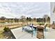 Backyard featuring a patio with outdoor seating overlooking a pond at 1055 Berrywood Dr, Greenwood, IN 46143