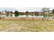 Backyard featuring a grass area with a fence overlooking a pond at 1055 Berrywood Dr, Greenwood, IN 46143