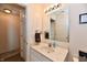 Bathroom featuring a single sink vanity and updated lighting fixtures at 1055 Berrywood Dr, Greenwood, IN 46143