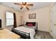Comfortable bedroom with a ceiling fan, window, and laminate flooring at 1055 Berrywood Dr, Greenwood, IN 46143