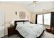 Bedroom with large windows, ceiling fan, and neutral wall colors at 1055 Berrywood Dr, Greenwood, IN 46143