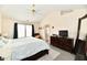 Bright bedroom with large window, ceiling fan, and en-suite bathroom at 1055 Berrywood Dr, Greenwood, IN 46143