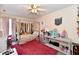Bright bedroom features a canopy bed, fan, and a variety of decorations and toys at 1055 Berrywood Dr, Greenwood, IN 46143