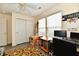 Well-lit bedroom showcasing a spacious closet, modern ceiling fan, and comfortable workspace at 1055 Berrywood Dr, Greenwood, IN 46143