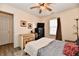 Bedroom with a bed, ceiling fan, laminate flooring, and natural light from a window at 1055 Berrywood Dr, Greenwood, IN 46143