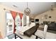 Dining area with views of the backyard and partial view of the living room at 1055 Berrywood Dr, Greenwood, IN 46143