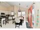 Charming dining area with modern lighting, table with chairs, and access to the outdoor at 1055 Berrywood Dr, Greenwood, IN 46143