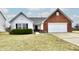 Charming single-Gathering home featuring a mix of white siding and brick with an attached two-car garage at 1055 Berrywood Dr, Greenwood, IN 46143