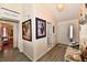 Stylish foyer with laminate flooring, neutral paint, and unique decor, creating a warm and inviting entrance to the home at 1055 Berrywood Dr, Greenwood, IN 46143