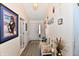 Well-lit foyer boasts neutral walls, laminate flooring, and decorative touches, offering a stylish and welcoming entrance to the home at 1055 Berrywood Dr, Greenwood, IN 46143
