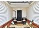 Cozy front porch with seating, a charming entrance, and a welcoming atmosphere, perfect for relaxation and greeting guests at 1055 Berrywood Dr, Greenwood, IN 46143