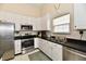 Kitchen features stainless steel appliances and white cabinets at 1055 Berrywood Dr, Greenwood, IN 46143