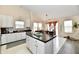 Bright kitchen with island, barstool seating, and ample natural light at 1055 Berrywood Dr, Greenwood, IN 46143
