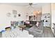 Inviting living room featuring a plush gray sectional, vaulted ceilings, and stylish decor at 1055 Berrywood Dr, Greenwood, IN 46143