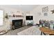 Comfortable living room features a fireplace, vaulted ceilings, and laminate flooring, making it ideal for Gathering gatherings at 1055 Berrywood Dr, Greenwood, IN 46143