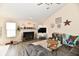 Inviting living room with a cozy fireplace, lots of light, and stylish decor creating a welcoming atmosphere at 1055 Berrywood Dr, Greenwood, IN 46143