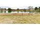 Backyard featuring a grass area with a fence overlooking a pond at 1055 Berrywood Dr, Greenwood, IN 46143