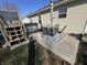 This backyard has a patio with a dining set and striped umbrella at 1217 Meadowood Dr, Danville, IN 46122
