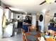 Dining room area featuring hardwood floors, a ceiling fan, and a large window at 1217 Meadowood Dr, Danville, IN 46122