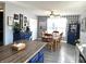 Dining room area featuring hardwood floors, a ceiling fan, a large window and nice decorations at 1217 Meadowood Dr, Danville, IN 46122