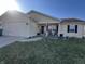 Charming ranch-style home featuring a well-manicured lawn and an inviting front porch at 1217 Meadowood Dr, Danville, IN 46122