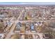 Aerial view of neighborhood with tree-lined streets, gray roofs, and tidy lawns at 1224 N Olney St, Indianapolis, IN 46201