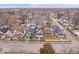 Aerial view of neighborhood street with various roof colors and manicured yards at 1224 N Olney St, Indianapolis, IN 46201