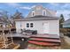 Backyard features deck, garden boxes, and gray siding at 1224 N Olney St, Indianapolis, IN 46201