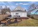 Backyard with wooden deck, garden plots, and gray siding at 1224 N Olney St, Indianapolis, IN 46201