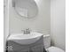 Bathroom with modern vanity, gray cabinets, and updated sink and faucet at 1224 N Olney St, Indianapolis, IN 46201