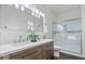 Stylish bathroom with a double sink vanity, modern fixtures, and a glass-enclosed shower at 1224 N Olney St, Indianapolis, IN 46201