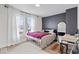 Bedroom with light walls, plush carpet, and dark accent wall at 1224 N Olney St, Indianapolis, IN 46201