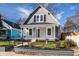 Charming gray two-story home with a welcoming front porch and well-maintained landscaping at 1224 N Olney St, Indianapolis, IN 46201