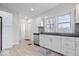 Modern kitchen featuring white cabinets, stainless steel appliances, and a gray subway tile backsplash at 1224 N Olney St, Indianapolis, IN 46201