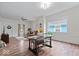 Inviting living room area with wood floors seamlessly transitioning into the dining space at 1224 N Olney St, Indianapolis, IN 46201