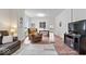 Bright living room with wood floors and a versatile layout, perfect for entertaining at 1224 N Olney St, Indianapolis, IN 46201