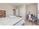 Comfortable bedroom with a large bed, workspace, large window, and neutral tones for a relaxing ambiance at 1225 Middlebury Dr, Westfield, IN 46074