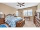 Comfortable bedroom with ceiling fan, dresser and bright natural light at 1225 Middlebury Dr, Westfield, IN 46074