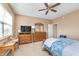 Cozy bedroom with ceiling fan, dresser, and natural light at 1225 Middlebury Dr, Westfield, IN 46074