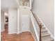 Inviting two-story foyer with hardwood floors, a staircase, and a convenient coat closet at 1225 Middlebury Dr, Westfield, IN 46074