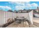 Cozy patio space with stone pavers, enclosed with a white fence, perfect for outdoor seating and relaxing at 1225 Middlebury Dr, Westfield, IN 46074