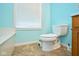 The bathroom features a soaking tub, tile flooring, toilet and window at 1288 Ivory Ct, Greenwood, IN 46143