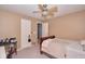A bedroom with a ceiling fan, neutral carpet, and closet with 2 doors at 1288 Ivory Ct, Greenwood, IN 46143