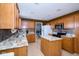 Modern kitchen featuring granite countertops, stainless steel appliances, a center island, and ample cabinet space at 1288 Ivory Ct, Greenwood, IN 46143