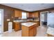 Beautiful kitchen with stainless steel appliances, an island, granite countertops, and an adjacent pantry for storage at 1288 Ivory Ct, Greenwood, IN 46143