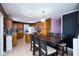 Well-lit kitchen with granite countertops, stainless steel appliances, an island, adjacent dining area and ample cabinet space at 1288 Ivory Ct, Greenwood, IN 46143